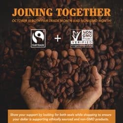 hands holding non-gmo fair trade coffee in shape of a heart to celebrate the month of october