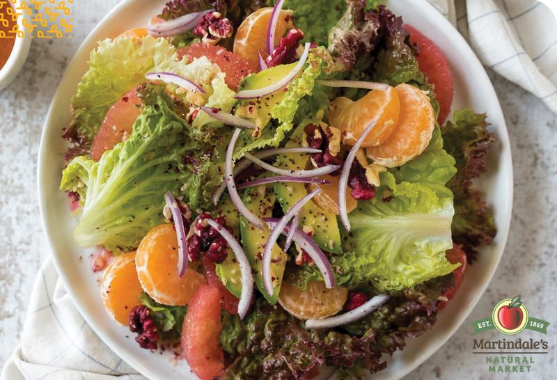 green salad with oranges and grapefruit, red onion, and vinaigrette