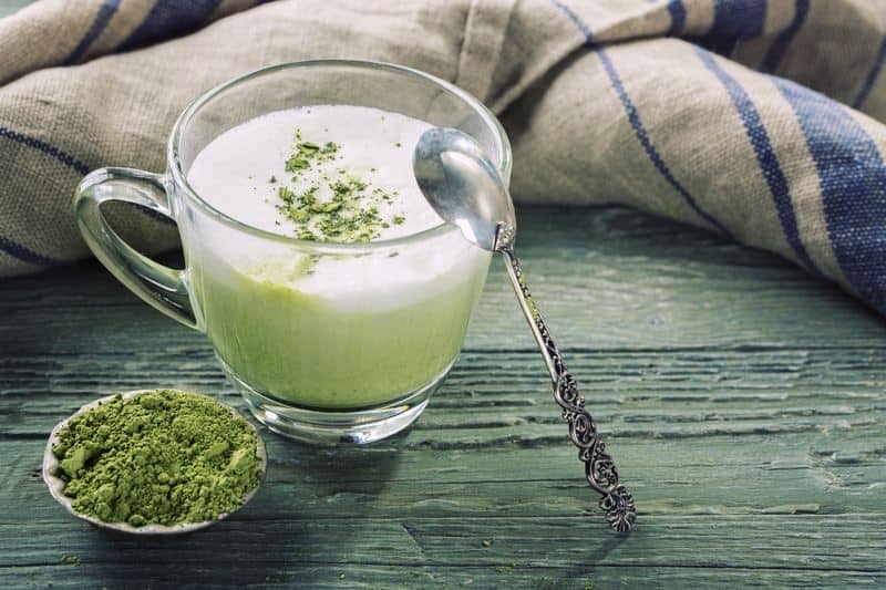 matcha powder and latte on table