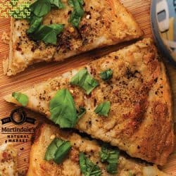 Dairy-Free White Pizza topped with fresh basil