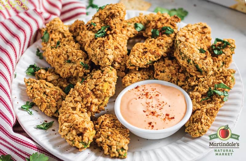 Avocado fries on plate with dipping sauce