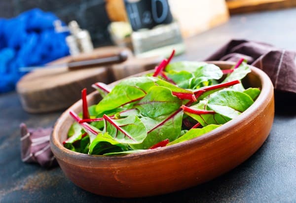 fresh salad greens in a bowl