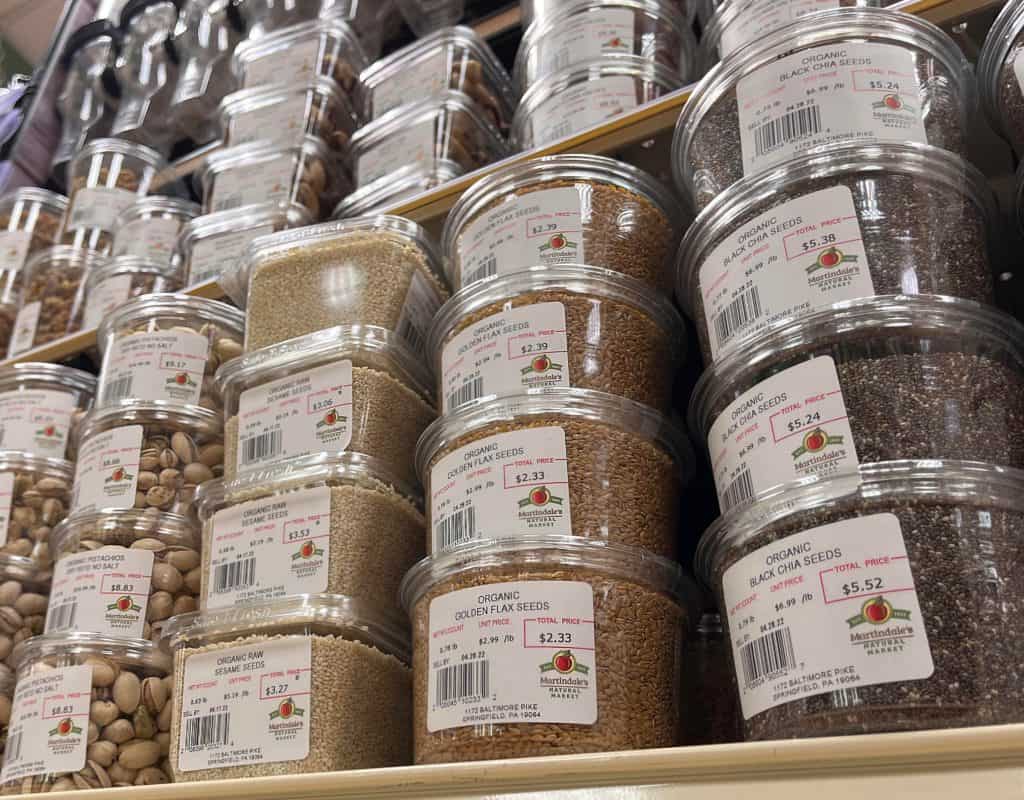 towers of pre-packed bulk foods such as nuts and seeds