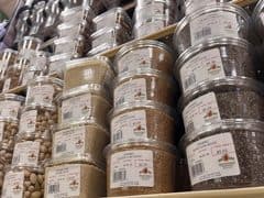 towers of pre-packed bulk foods such as nuts and seeds