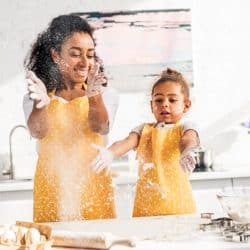 A mother and daughter baking in the kitchen