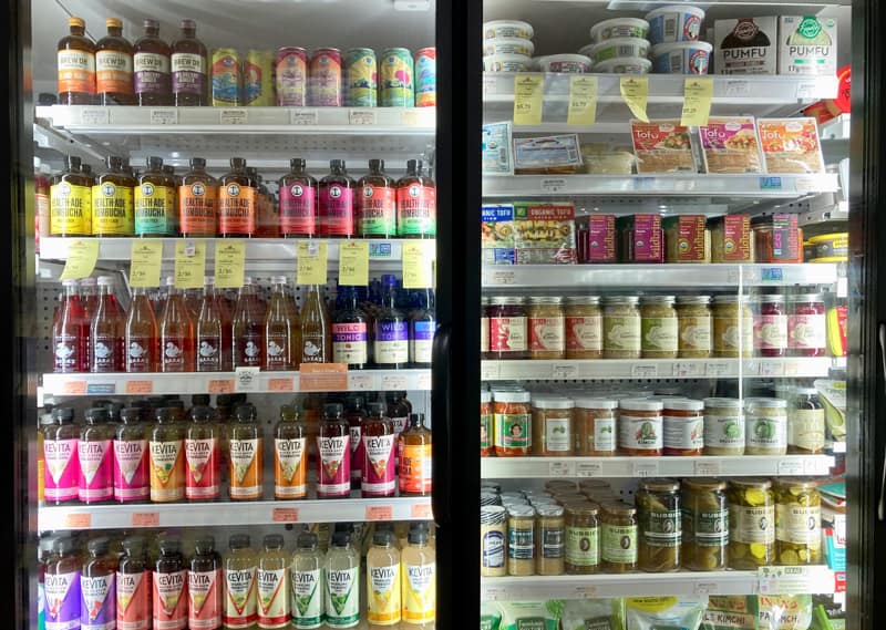 kombucha, kimchi, tofu, pickles and fermented foods in the refrigerated case