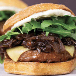 A burger with garlic aoli and caramelized onions, made with beyond burger recipe