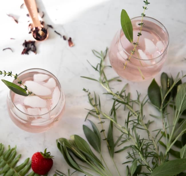 Healthy mocktails surrounded by botanicals