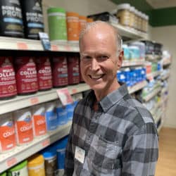 Supplement buyer and co-owner, Mark, in the vitamin aisle